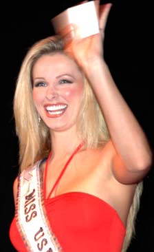 Miss USA 2004 Shandi Finnessey waves to the crowd during a July Fourth USO show at Camp Casey.