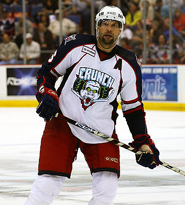 Daniel in full Hockey gear in action on the ice - Colorado Center for the  Blind