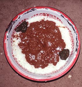West African maafe or groundnut stew, prepared by a Senegalese cook.