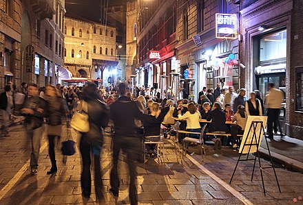 Night life and outdoor cafe tables at Via Guglielmo Marconi