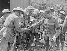 A raiding party of 11th Royal Scots preparing for action in July 1918 11th Royal Scots raiding party 12-07-1918.jpg