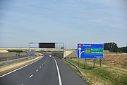 Road in Poland with a sign displaying road code in format being readable for driver travelling at motorway speed. Tagged with ref=*