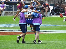 Jenna Bruton (North Melbourne) was assisted from the field during the first quarter AFLWGF - Jenna Bruton injury.jpg