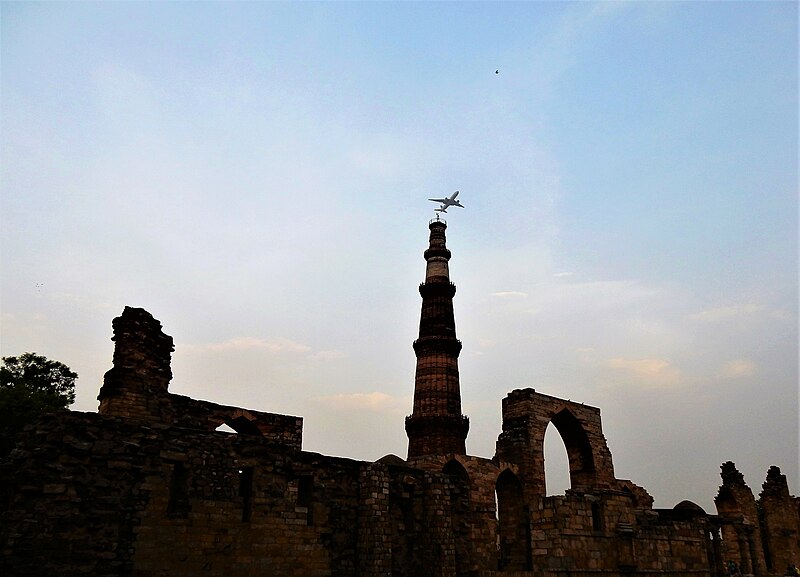 File:An aircraft flies over the Kutub Minar.jpg