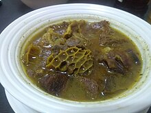 A bowl of Peppersoup with different meats. Assorted meat pepper soup at Lagos Island.jpg