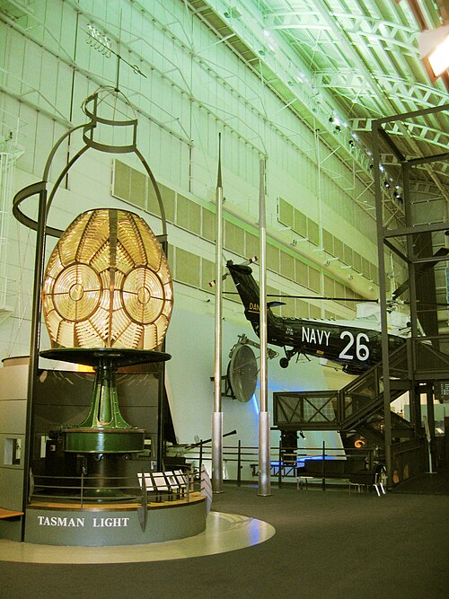 The original lenses from the Tasman Island Lighthouse; centrepiece of the Tasman Light Gallery. The Westland Wessex helicopter in the background is su