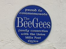 Bee Gees plaque at Maitland Terrace/Strang Road intersection in Union Mills, Isle of Man