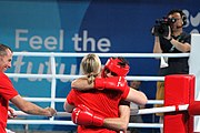 Deutsch: Boxen bei den Olympischen Jugendspielen 2018 Tag 12, 18. Oktober 2018 - Kampf um Bronze im Leichten Weltergewicht Jungen – Hassan Azim (Großbritannien, rot) schlägt Mohammed Boulaouja (Marokko, blau) RSC; Ringrichter ist Wulfren Olivares Peréz (Kolumbien). English: Boxing at the 2018 Summer Youth Olympics on 18 October 2018 – Bronze Medail Match Light Welterweight Boys - Hassan Azim (Great Britain, red) beats Mohammed Boulaouja (Morocco, blue) RSC; Referee is Wulfren Olivares Peréz (Columbia). Español: Boxeo en los Juegos Olímpicos Juveniles de Verano de 2018 en 18 de octubre de 2018 - Medalla de bronce de los hombres ligeros de peso welter: Hassan Azim (Gran Bretaña, rojo) vence a Mohammed Boulaouja (Marruecos, azul) RSC; El árbitro es Wulfren Olivares Peréz (Colombia).