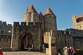 Carcassonne - Plateau Narbonnaise - View WNW on Drawbridge-Entrance to La Cité, Dame Carcas & Porte Narbonnaise.jpg