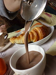 Image 28Hot chocolate served with a croissant (from List of drinks)