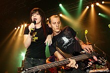 Vocalist Elektra and guitarist Pinguim at a performance in 2008 Fake Number5.jpg