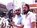 Preparando una escena, con una cámara de 16 mm. en las calles de Cali, Enrique Gutiérrez y Simón, con Hernando González
