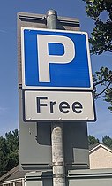 Free parking has hidden societal costs Free parking sign cropped.jpg