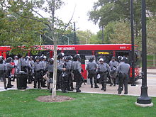 Riot police exit a city bus in the Oakland neighborhood on September 24. G20 PGH riot police bus.JPG