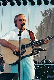 Before Almost Blue, Costello recorded "Stranger in the House" with country singer George Jones (pictured in 2012). George Jones.jpg