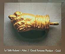A golden good fortunes pendant shaped as a fig sign from Hellenistic Period (Eskisehir Archaeology Museum) Good Fortunes Pendant (Hellenistic Period - Eskisehir Archaeology Museum).jpg