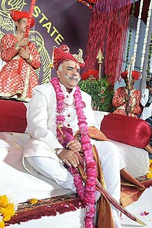 HH Maharaja Shrimant Hemendra Singh Rao Pawar of the Dhar State seated on the 'Gadi' of the Kshatriya Maratha-Rajput Pawar (Puar/Parmar) Clan. The coronation of the 12th Maharaja of the Dhar State was solemnised on 15 January 2015 at the 'Rajwada' (Old Palace) of Dhar. HH Maharaja Shrimant Hemendra Singh Rao Pawar of Dhar State.jpg