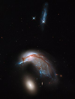 <span class="mw-page-title-main">NGC 2936</span> Interacting spiral galaxy in the constellation Hydra