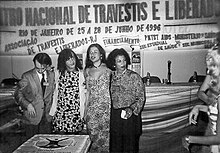 ENTLAIDS in 1996. From left to right: Andre Fernandes, Jovanna Baby (president of ASTRAL), Indianara Siqueira, and Katia Tapety. IV-ENTLAIDS-1996.jpg