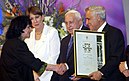 Israel prize award ceremony Moshe Katsav presenting author Yehudith Hendel with the literature Israel prize D810-069.jpg