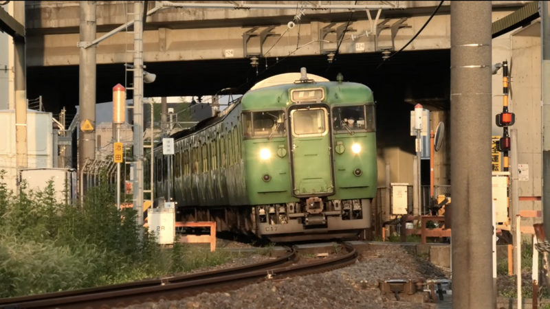 File:JRW 113 green set C17 Kusatsu Line near Tehara Station 2022-09-15.png