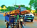 Joseph H Ahissou photo tricycle motorbike for industrial woods transportation in Natitingou.jpg
