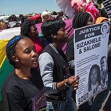 Soweto Pride 2012: A young person protests the murders of Sizakele Sigasa and Salome Masooa Justice For Sizakhele & Salome (8036300204).jpg