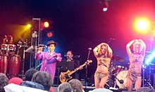 Kid Creole and the Coconuts performing at Ascot Racecourse in 2008 Kid Creole and the Coconuts Ascot (2747837623).jpg