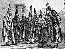 Depiction of Ku Klux Klan in North Carolina in 1870, based on a photograph taken under the supervision of a federal officer who seized Klan costumes Ku Klux Klan costumes in North Carolina in 1870.jpg