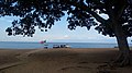 Lake Kivu beach featuring touring boats.jpg