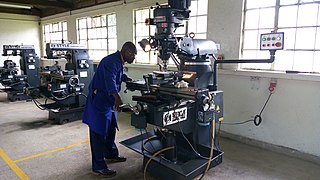 A Technician operating a CNC Lathe Machine in one of the Labs