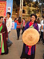 A Quan họ female artist holding a nón quai thao at Lim festival, 2010