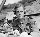 Lieutenant Peter Handford, a sound recordist with the Army Film Unit, poses with his equipment after the end of hostilities in 1945. BU8364.jpg