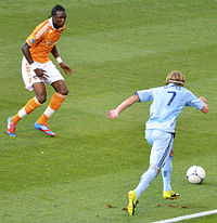 Macoumba Kandji, a forward for the Houston Dynamo against Chance Myers of Sporting KC at Livestrong Sporting Park MacoumbaKandji vs ChanceMyers 07JUL2012.jpg