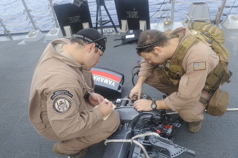 File:Members of the U.S. Coast Guard Law Enforcement Detachment examine an engine seized from a suspicious dhow aboard the guided-missile destroyer USS Farragut (DDG 99) while under way in the Gulf of Aden March 15 100415-N-OM347-210.jpg