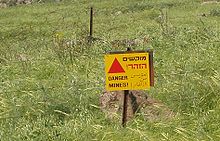Minefield warning on the Golan Heights, still valid more than 40 years after creation of the field by the Syrian army Minefield warning.JPG