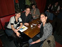 Reed between BOMB magazine's senior editor Monica de la Torre and editor-in-chief Betsy Sussler. MonicadelaTorre John Reed Betsy Sussler 2010 Shankbone.jpg