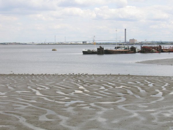 Mudflats on the Thames, with the Queen Elizabeth II Bridge in the far background