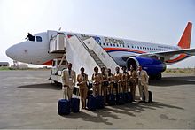 Nasair staff and an Airbus A320. Nasair Eritrea Airbus A320 UR-SDV-1.jpg