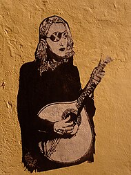 A graffiti in Lisbon depicting Madonna's alter-ego for the album Night bike ride (48783330992).jpg