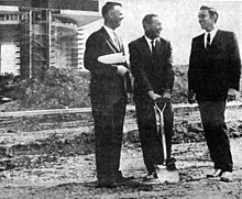 October 1963 groundbreaking event by Jay Swayze. Constructor Walter Nolan on the left is holding the blueprints; entertainer Jimmy Dean observes the proceedings. October 1963 Jay Swayze with shovel.jpg