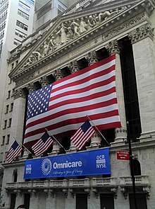 The New York Stock Exchange Building on September 1, 2011 with an Omnicare banner marking the 30th anniversary of the company's public listing. Omnicare NYSE 2011 Shankbone.jpg