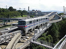 A Osaka Monorail 2000 series train, identical to the QKZ2 rolling stock originally used. Osaka-Monorail-Crossroads.jpg