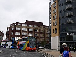The two Pride-liveried (well, sort-of) buses attending Pride in Hull 2022 staging along Queen's Dock Avenue.