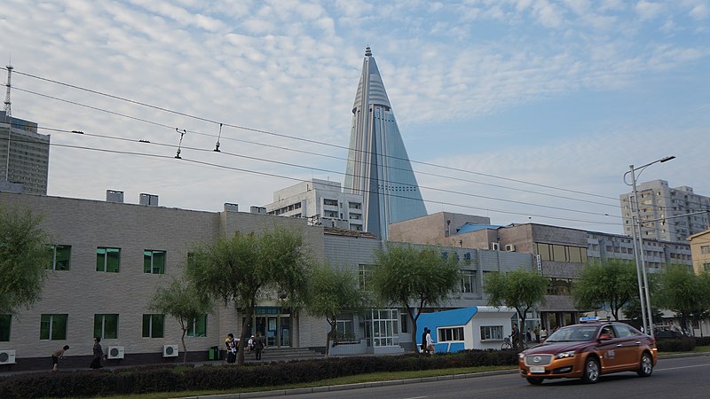 File:Pyongyang streets with Ryugyong Hotel in background (15481392614).jpg