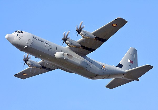 A C-130J flies over head