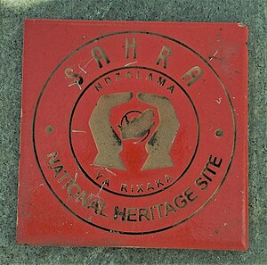 The marker used to show protection as a National Heritage Site. SAHRA National Heritage Site Marker, Sharpeville Massacre Graves.jpg