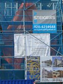 Composition of scaffolding with blue building canvas and afvertisement during the renovation of an old brick house facade at the street Schippergracht, downtown Amsterdam city; free photo by Fons Heijnsbroek, Autumn 2008