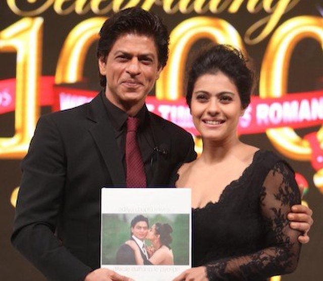 Shah Rukh Khan and Kajol celebrating 1000 weeks of continuous showing of Dilwale Dulhania Le Jayenge in 2014