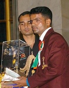 Vijay Kumar receiving the 2006 Arjuna Award for shooting. Shri Vijay Kumar receiving 2006 Arjuna Award for Shooting.jpg